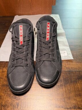Prada Men’s Black High-Top Sneakers with Red Logo Stripe
